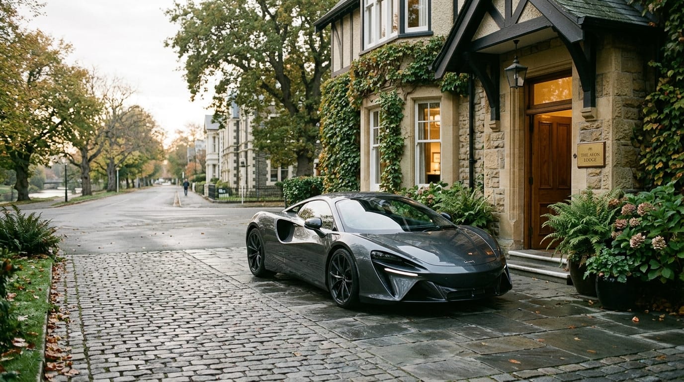 Quiet luxury supercar experience in Christchurch with an elegant car outside a boutique hotel